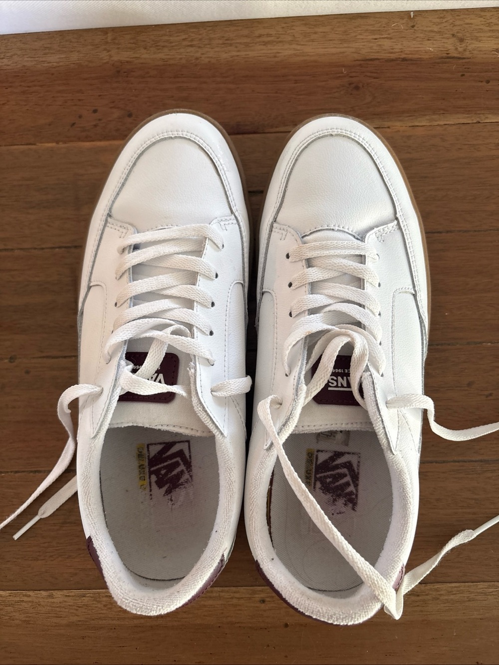 Vans women’s White Sneakers with Maroon Heel and Tongue Tabs
